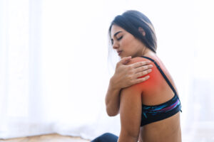 woman suffering shoulder pain