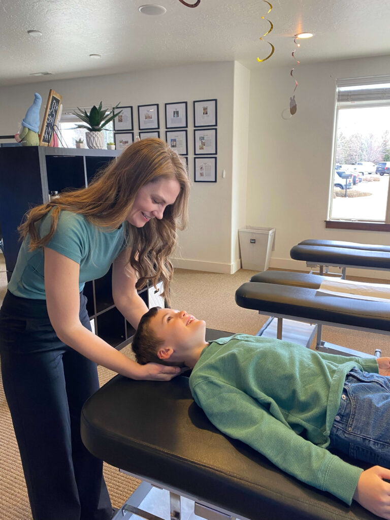 Dr. Kristin Moore attend patient pediatric care treatment